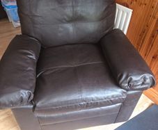 dark brown faux leather armchair.