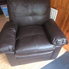 dark brown faux leather armchair.