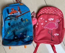 Two NEW school bags. Disney Planes pull along. Pink Flamingo back pack.
