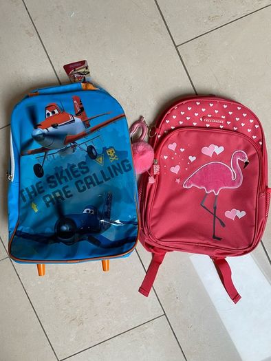 Two NEW school bags. Disney Planes pull along. Pink Flamingo back pack.