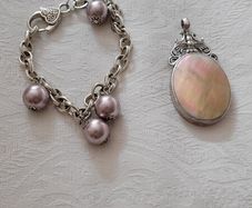 silver bracelet and pendant