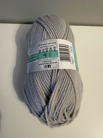 5 balls of grey yarn wool