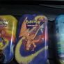 Three Pokemon tins with two coins. Image 3
