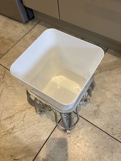 Silver metal square shape plant stand with matching white plastic pot