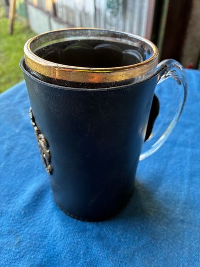 Vintage pint glass in leather holder