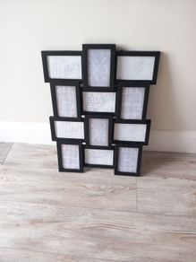 Black Picture frame. Holds 12 pictures