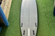 Second Hand Mark Phipps Surfboards 7'2 One Bad Egg Black Rails Grey Deck and Bottom FCS II Sides in
