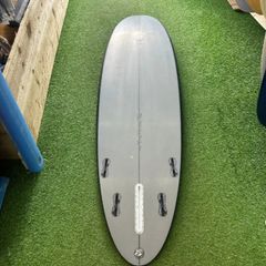 Second Hand Mark Phipps Surfboards 7'2 One Bad Egg Black Rails Grey Deck and Bottom FCS II Sides in
