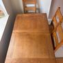solid oak extendable dining table + 6 chairs Image 4