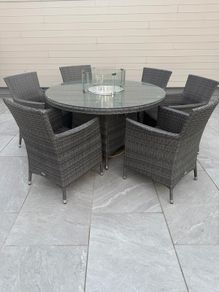 Ratan table and chairs with fire pit