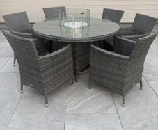 Ratan table and chairs with fire pit