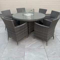 Ratan table and chairs with fire pit