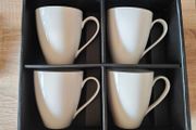 Four white mugs