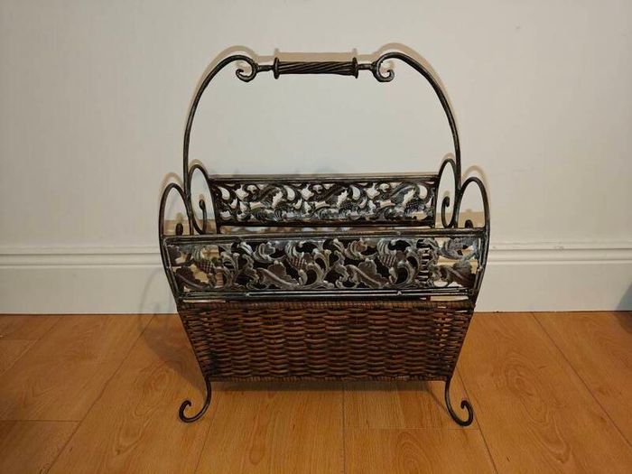 Antique iron and wicker magazine rack. Vintage antique magazine rack.