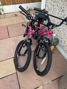 2 pink kids bikes