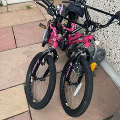 2 pink kids bikes