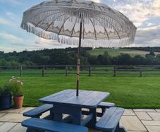Large garden table and 4 bench chairs