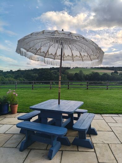Large garden table and 4 bench chairs