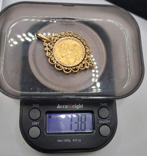 Full sovereign coin mounted in 9ct yellow gold pendant
