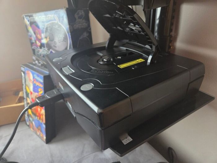 Sega Saturn w/ 3D Control Pad, Arcade Racer, Lightgun and Games