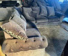 Grey corner sofa with scatter cushions