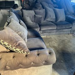 Grey corner sofa with scatter cushions