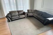 Black corner sofa with matching 2 seater