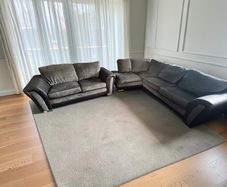 Black corner sofa with matching 2 seater