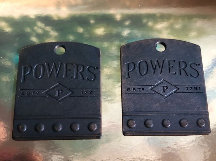 Powers whiskey medal