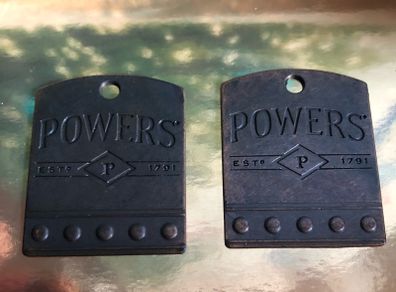 Powers whiskey medal