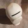 A vintage novelty money box in form of a young child sitting on a toilet (1930s to 1960s) Image 6
