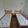 2x Solid Oak Single Beds incl mattress and bedside locker. Image 4
