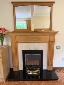 Oak fireplace surround black granite hearth