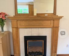 Oak fireplace surround black granite hearth
