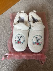 a pair of Carolyn Donnelly embroidered dog-themed mule slippers