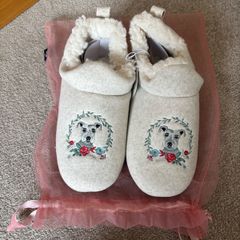 a pair of Carolyn Donnelly embroidered dog-themed mule slippers