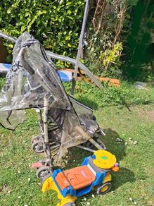 Stroller/tonka truck/ironing board/weight bench.
