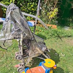 Stroller/tonka truck/ironing board/weight bench.