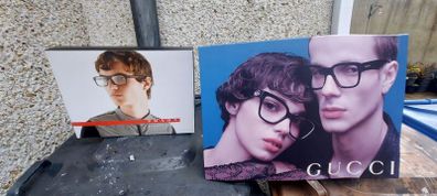 2 x glasses advertising double sided showcards displays items,,nice condition, well known brands , sold as seen ,