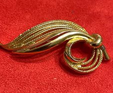 gold tone brooch