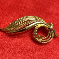 gold tone brooch