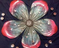 Decorative metallic flower with light reflecting effect