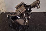 Novelty metal wine bottle holder