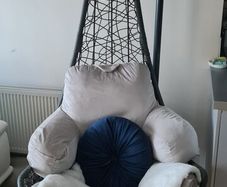 egg chair, original outdoor grey cushion. Including extra cushions & throw. Used indoors. Will include large and small cushion and fake throw