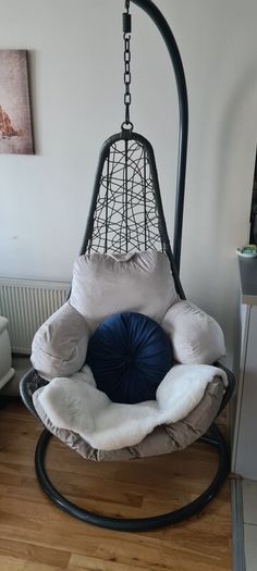 egg chair, original outdoor grey cushion. Including extra cushions & throw. Used indoors. Will include large and small cushion and fake throw