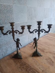 two matching brass candlesticks
