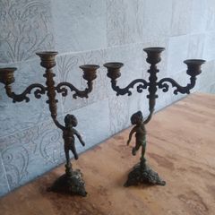 two matching brass candlesticks