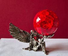 Crackle glass ball and metal angle base.