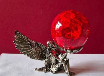 Crackle glass ball and metal angle base.