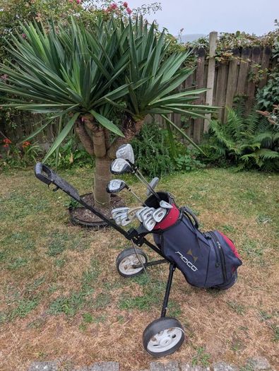 Cheap set of golf clubs and trolley